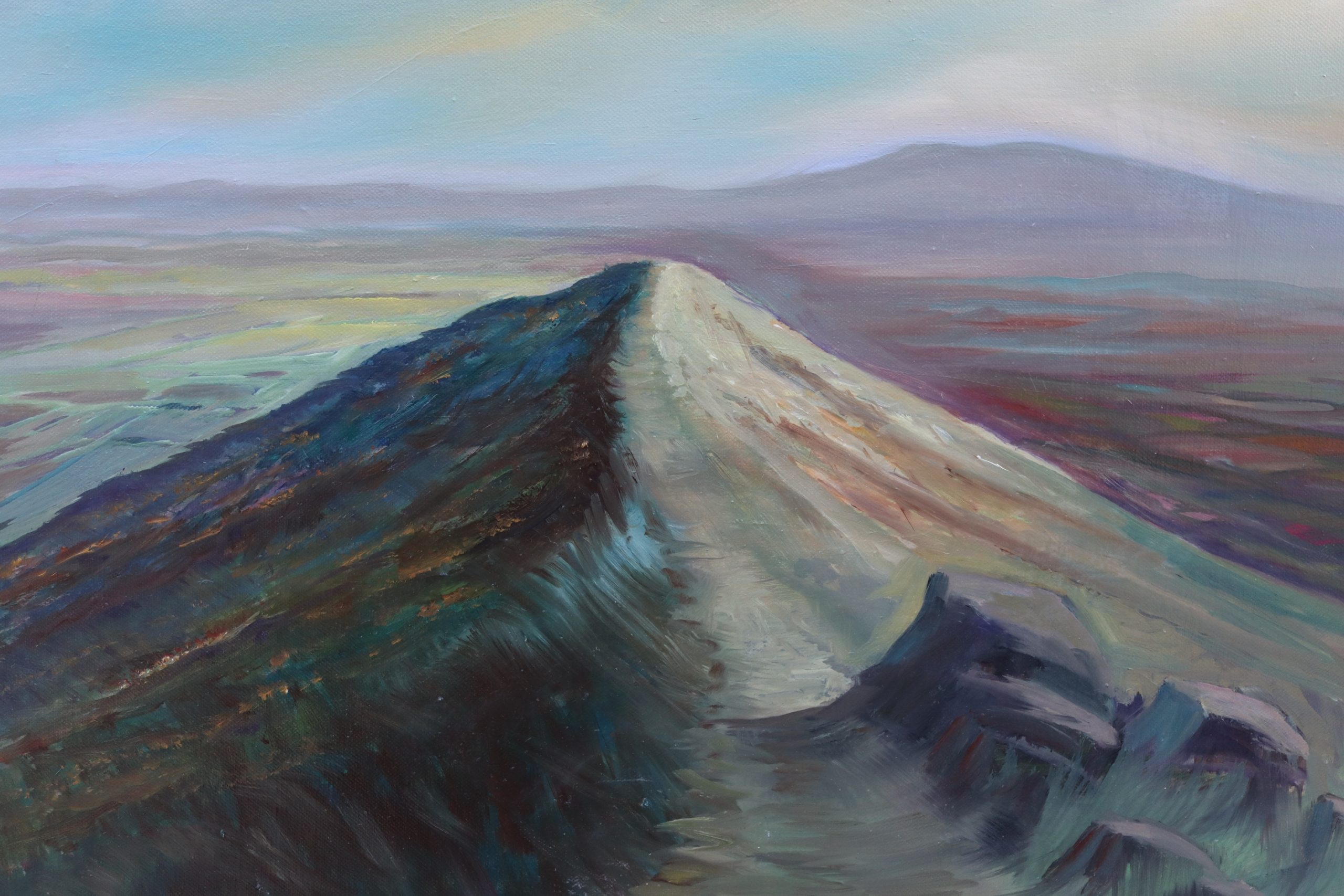 Skirrid Fawr, often referred to as just the Skirrid, is an easterly outlier of the Black Mountains in Wales. It forms the easternmost part of the Brecon Beacons National Park. The smaller hill of Ysgyryd Fach or "Little Skirrid" l